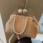 Novas bolsas de palha listradas de cor sólida populares na primavera e no verão, elegantes bolsas crossbody com corrente de pérola de nicho,
