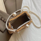 Novas bolsas de palha listradas de cor sólida populares na primavera e no verão, elegantes bolsas crossbody com corrente de pérola de nicho,